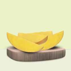 Freshly cut mango slices showcased on a wooden board against a minimalist green background.